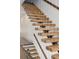 Unique staircase design featuring wood steps, metal supports, and cable railings at 560 John Wesley Dobbs Ave, Atlanta, GA 30312