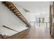 Modern staircase with floating wooden steps and unique cable railing system in a bright, open space at 560 John Wesley Dobbs Ave, Atlanta, GA 30312