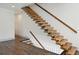 Modern staircase with floating wooden steps and unique cable railing system at 560 John Wesley Dobbs Ave, Atlanta, GA 30312