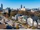 A picturesque street view showcases modern homes against the vibrant Atlanta skyline at 560 John Wesley Dobbs Ave, Atlanta, GA 30312