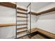 Spacious walk-in closet with custom wood shelving and ample storage space at 560 John Wesley Dobbs Ave, Atlanta, GA 30312