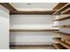 Large walk-in closet featuring custom wood shelving and modern design at 560 John Wesley Dobbs Ave, Atlanta, GA 30312