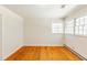Bright bedroom featuring hardwood floors and natural light at 3435 Macland Rd, Powder Springs, GA 30127