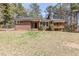 Charming brick home featuring a well-maintained lawn and inviting front entrance at 3435 Macland Rd, Powder Springs, GA 30127
