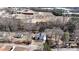 An aerial shot capturing the home's setting amid trees, with views of nearby schools and community buildings at 510 Forest St, Buford, GA 30518