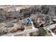 Aerial view of home with a long driveway, grey roof, detached garage on a large lot surrounded by many trees at 510 Forest St, Buford, GA 30518