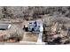 An aerial view of the house showing its location within a wooded lot and proximity to neighboring homes at 510 Forest St, Buford, GA 30518