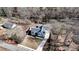 Overhead shot showcasing the property's layout, driveway, landscaping, and proximity to natural surroundings at 510 Forest St, Buford, GA 30518