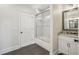 Stylish bathroom with marble shower, gray tile flooring, and granite-topped vanity at 510 Forest St, Buford, GA 30518