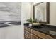 Stylish powder room featuring vessel sink, granite countertop, and decorative mirror at 510 Forest St, Buford, GA 30518