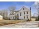 Attractive two-story home with a landscaped front yard, long driveway, and attached garage at 510 Forest St, Buford, GA 30518