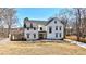 Beautiful white two-story home featuring a manicured lawn and inviting front entrance at 510 Forest St, Buford, GA 30518