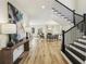 Spacious foyer with staircase leading to the upper level, and hardwood flooring at 510 Forest St, Buford, GA 30518