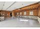 Spacious unfinished garage with exposed wood beams, natural light, and brick accents at 510 Forest St, Buford, GA 30518