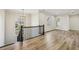 Hallway with hardwood floors and black railing at 510 Forest St, Buford, GA 30518