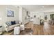 Bright, airy kitchen and a seating area with hardwood flooring, granite countertops, and modern appliances at 510 Forest St, Buford, GA 30518
