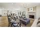 Open living room with fireplace and views into kitchen, dining area, and backyard at 510 Forest St, Buford, GA 30518
