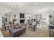 Spacious open-concept living room features a fireplace and flows into the kitchen at 510 Forest St, Buford, GA 30518