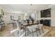A bright, open-concept living space features hardwood floors and a dining table at 510 Forest St, Buford, GA 30518