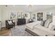 Bright main bedroom featuring hardwood floors, comfortable seating, and ample windows at 510 Forest St, Buford, GA 30518