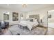 A spacious main bedroom with a luxurious king bed and stylish decor at 510 Forest St, Buford, GA 30518