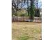 Large backyard featuring a wooden fence, offering privacy and a sense of seclusion at 956 S Deshon Rd, Lithonia, GA 30058