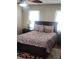 Cozy bedroom featuring natural light, dark furniture, and hardwood floors at 956 S Deshon Rd, Lithonia, GA 30058