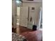 Bedroom with hardwood floors leading to on-suite bathroom at 956 S Deshon Rd, Lithonia, GA 30058