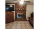 Living room brick fireplace, offering cozy appeal, with tile floors and wood trim at 956 S Deshon Rd, Lithonia, GA 30058