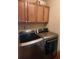 Modern laundry room with front-load washer and dryer, and ample storage at 956 S Deshon Rd, Lithonia, GA 30058