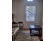 Living room with a large window, sofa, and patterned rug at 956 S Deshon Rd, Lithonia, GA 30058