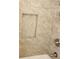Shower featuring marble tile and a built-in shelf at 956 S Deshon Rd, Lithonia, GA 30058