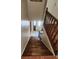 Wooden staircase leading to the home's entrance, featuring natural light at 956 S Deshon Rd, Lithonia, GA 30058