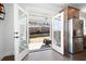 Bright kitchen featuring stainless steel appliances and double glass doors leading to the backyard at 140 Rigby Ne St, Marietta, GA 30060