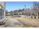 Wide view of a yard featuring lush green trees on a bright, sunny day at 2510 Thorngate Dr, Acworth, GA 30101