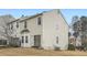 Back view of a house with large windows and a small deck at 2510 Thorngate Dr, Acworth, GA 30101