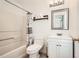 Cozy bathroom with shower/tub combo, toilet and vanity with decorative mirror at 2510 Thorngate Dr, Acworth, GA 30101