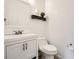 Clean and simple half-bath with white vanity and fixtures at 2510 Thorngate Dr, Acworth, GA 30101