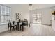 Dining room with natural light, wood floors, and a view of the backyard at 2510 Thorngate Dr, Acworth, GA 30101
