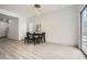 Bright dining area featuring wood floors, modern lighting, and sliding glass doors at 2510 Thorngate Dr, Acworth, GA 30101