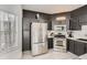 Contemporary kitchen with stainless steel appliances and dark cabinets at 2510 Thorngate Dr, Acworth, GA 30101