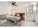 Bright main bedroom with tray ceilings, wood accent wall, and modern decor at 2510 Thorngate Dr, Acworth, GA 30101