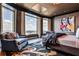 Spacious bedroom with a comfortable seating area and a beautiful view from the large windows at 3376 Peachtree Ne Rd # 56, Atlanta, GA 30326