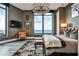 Bedroom with a large window and a luxurious bed topped by crystal chandelier at 3376 Peachtree Ne Rd # 56, Atlanta, GA 30326