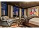 Luxurious bedroom featuring a sitting area, city views, and elegant decor at 3376 Peachtree Ne Rd # 56, Atlanta, GA 30326