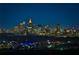 Nighttime cityscape view featuring illuminated skyscrapers against a dark blue sky, highlighting the urban skyline at 3376 Peachtree Ne Rd # 56, Atlanta, GA 30326