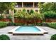 Private courtyard features a reflecting pool, manicured landscaping, and a cozy gathering spot at 3376 Peachtree Ne Rd # 56, Atlanta, GA 30326