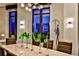 Close-up of dining table with vases and greenery, complemented by stylish chairs and window views at 3376 Peachtree Ne Rd # 56, Atlanta, GA 30326