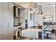 Modern kitchen featuring an island with seating, stainless steel appliances, and unique pendant lighting at 3376 Peachtree Ne Rd # 56, Atlanta, GA 30326