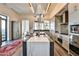 Bright, modern kitchen with stainless steel appliances and a large center island with bar seating at 3376 Peachtree Ne Rd # 56, Atlanta, GA 30326